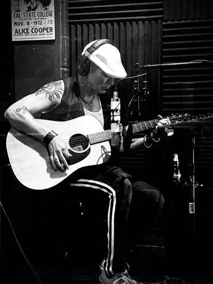 Rik Avalos recording acoustic guitar in the studio
